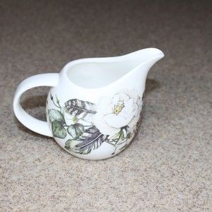 New Upcycled altered decor creamer boho floral feather motif.